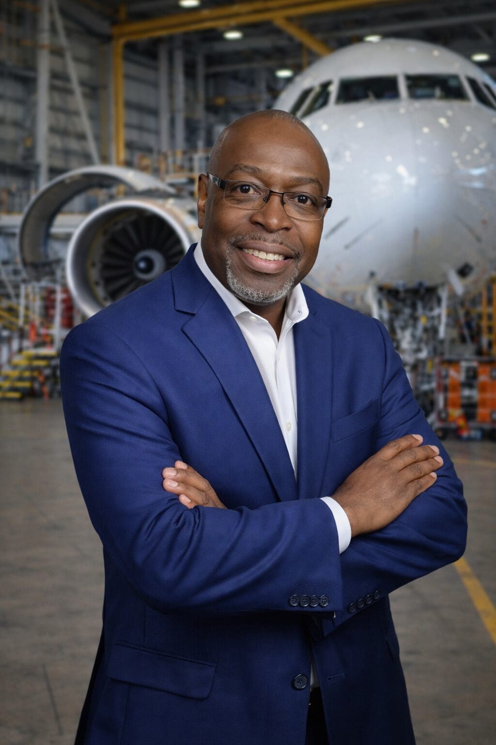 Professional portrait in hangar with airplane